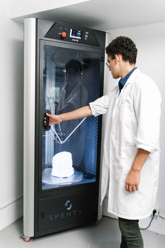 rapid prototyping expert operating a 3D printing machine